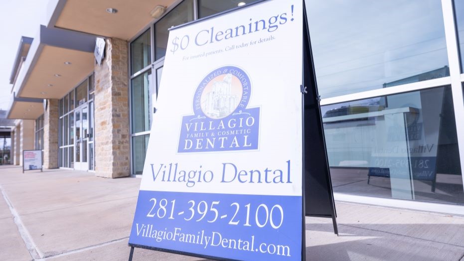 Sign for 0 dollar cleanings in front of dental office