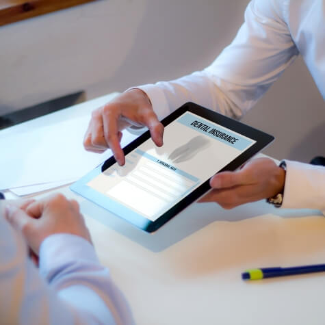 Showing patient dental insurance form on a tablet