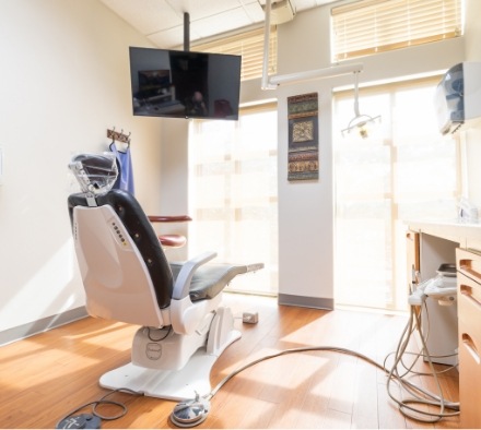 Dental examination room with sunlight streaming through window