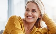 Smiling woman in a yellow sweater