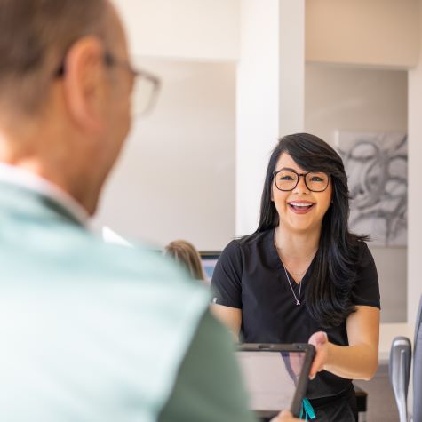 Man checking in with dentist who is open weekends