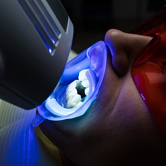 a dentist speaking with a patient